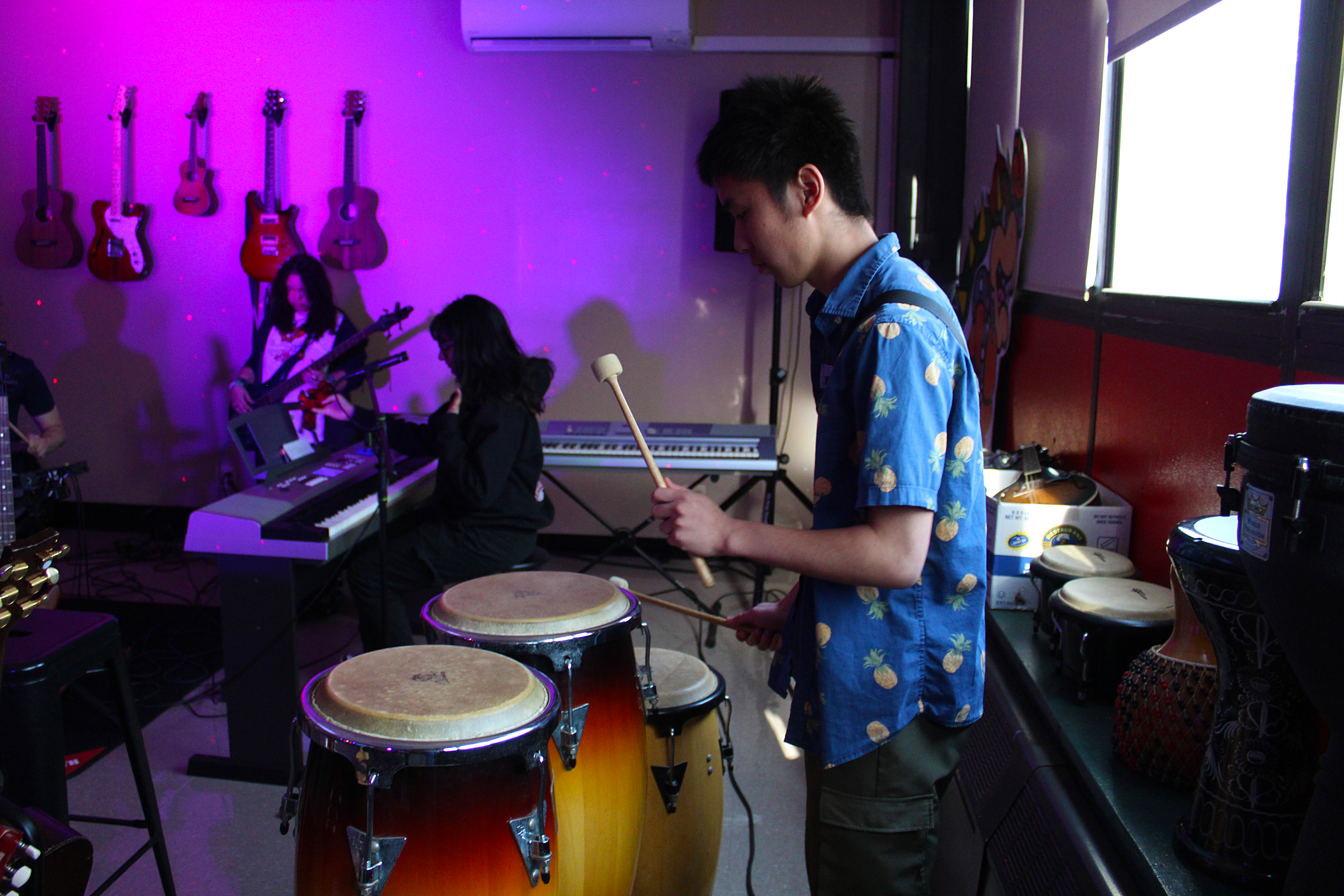 male student playing drums
